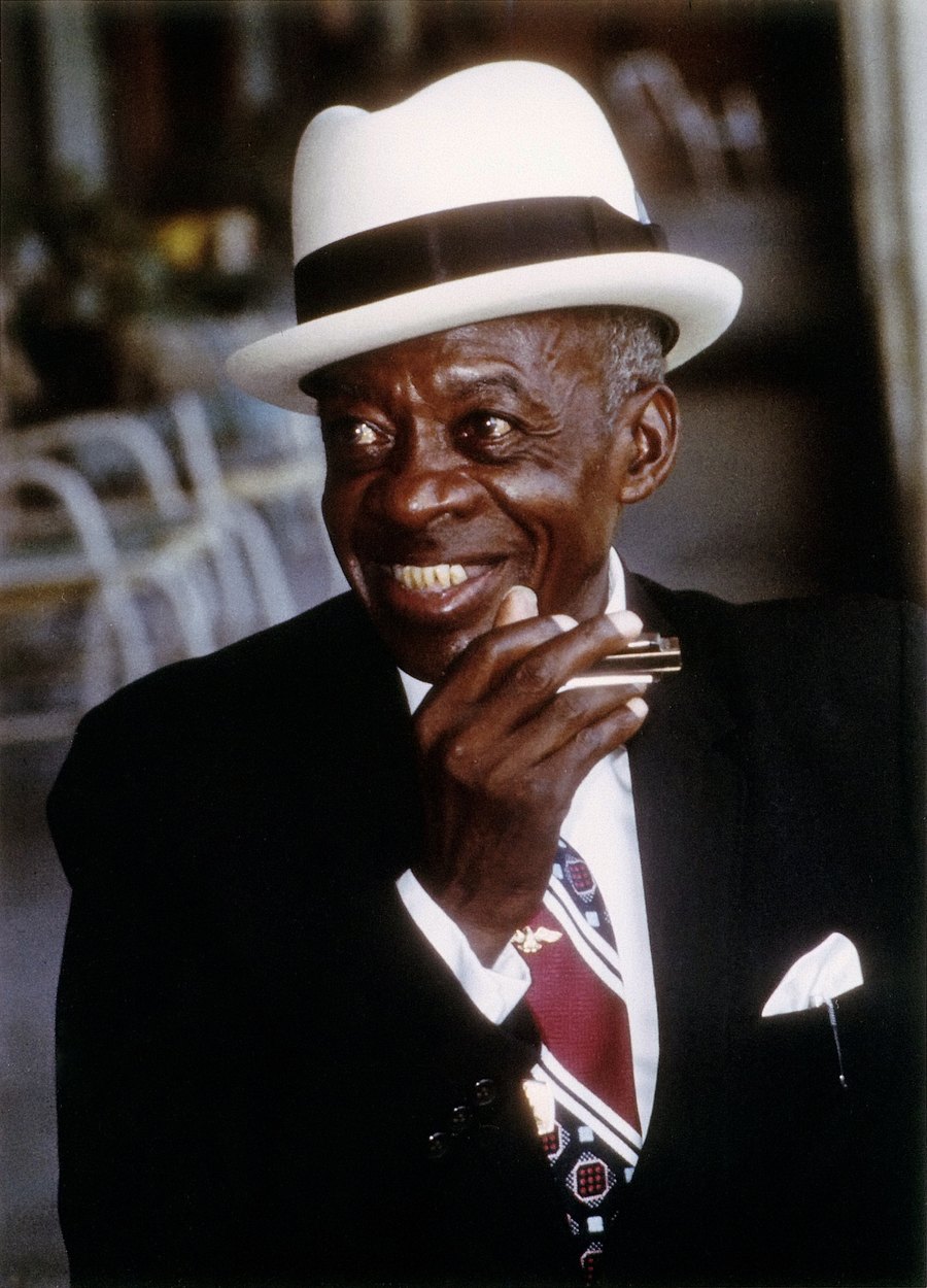 DeFord Bailey with the harmonica he called his “harp,” photographed in the 1970s.